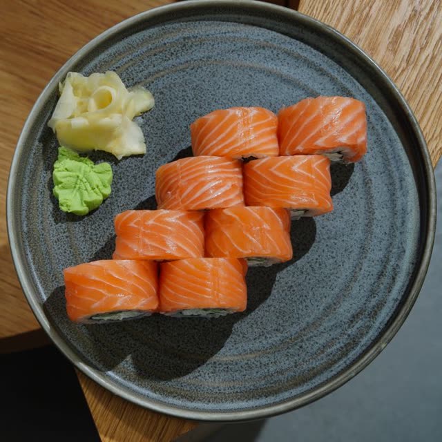 402 · Alaska Inside Out with salmon, cucumber, masago, coated in sesame