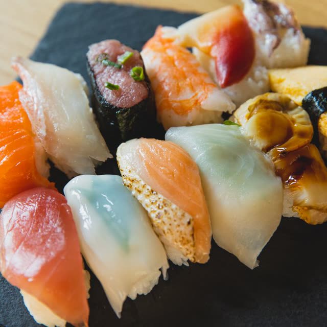 B13 · 16 pcs assorted nigiri (salmon, tuna, crab, prawn, radish)