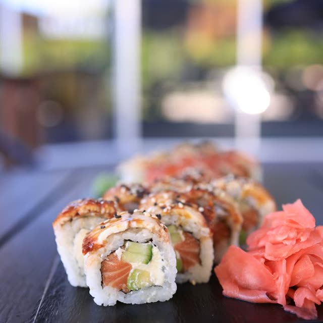401 · Sake Inside Out with salmon, avocado, masago, coated in sesame