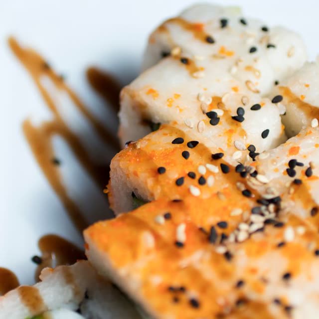 406 · Unagi Inside Out with salmon skin, cucumber, coated in unagi sauce
