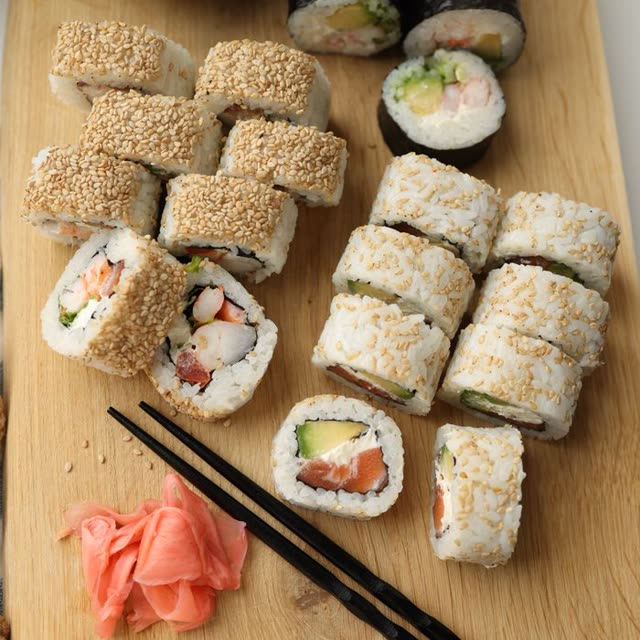 504 · Sake Roll with salmon, avocado, cream cheese, coated in sesame