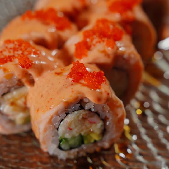 500 · Hot Spicy Ebi Roll with prawns, cucumber, leek, cocktail sauce, coated in sesame